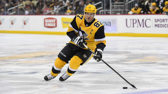 PITTSBURGH, PA - NOVEMBER 09: Pittsburgh Penguins Center Sidney Crosby (87) skates with the puck during the first period in the NHL game between the Pittsburgh Penguins and the Chicago Blackhawks on November 9, 2019, at PPG Paints Arena in Pittsburgh, PA.