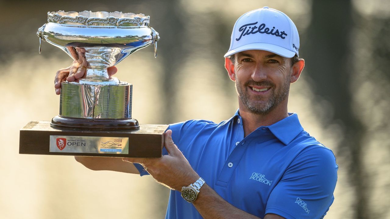 Australia's Wade Ormsby poses with the champion's trophy after winning in the final round of the Hong Kong Open golf tournament at the Hong Kong Golf Club on January 12, 2020.