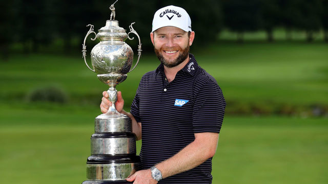 JOHANNESBURG, SOUTH AFRICA - JANUARY 12: Branden Grace of South Africa celebrates with the trophy after winning the tournament during Day Four of the South African Open at Randpark Golf Club on January 12, 2020 in Johannesburg, South Africa.