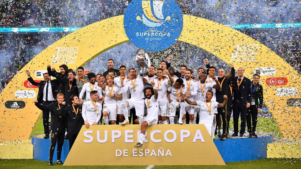 Real Madrid's players celebrate winning the Spanish Super Cup final between Real Madrid and Atletico Madrid on January 12, 2020, at the King Abdullah Sports City in the Saudi Arabian port city of Jeddah.