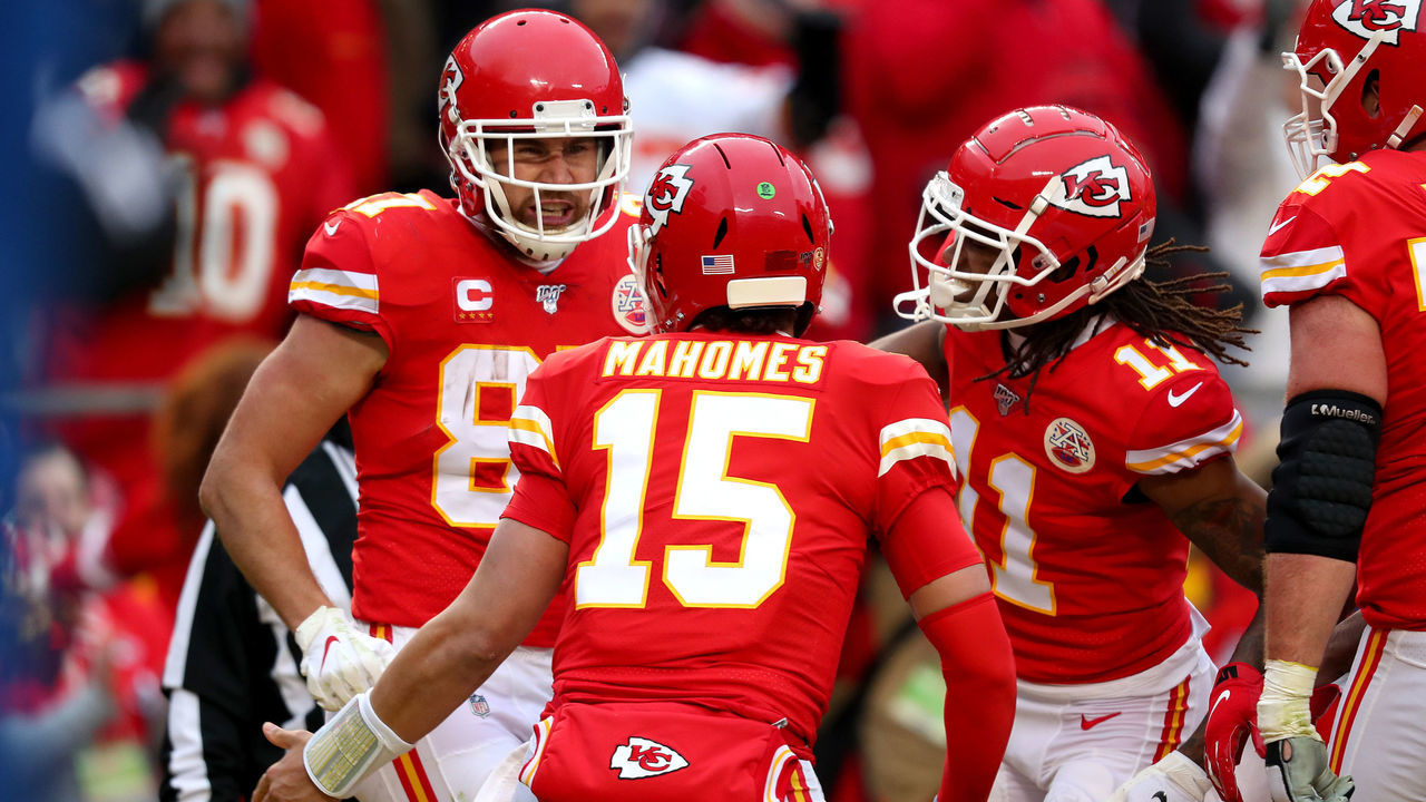 KANSAS CITY, MISSOURI - JANUARY 12: Travis Kelce #87 and Patrick Mahomes #15 of the Kansas City Chiefs celebrate their touchdown with teammate Demarcus Robinson #11 against the Houston Texans during the second quarter in the AFC Divisional playoff game at Arrowhead Stadium on January 12, 2020 in Kansas City, Missouri.