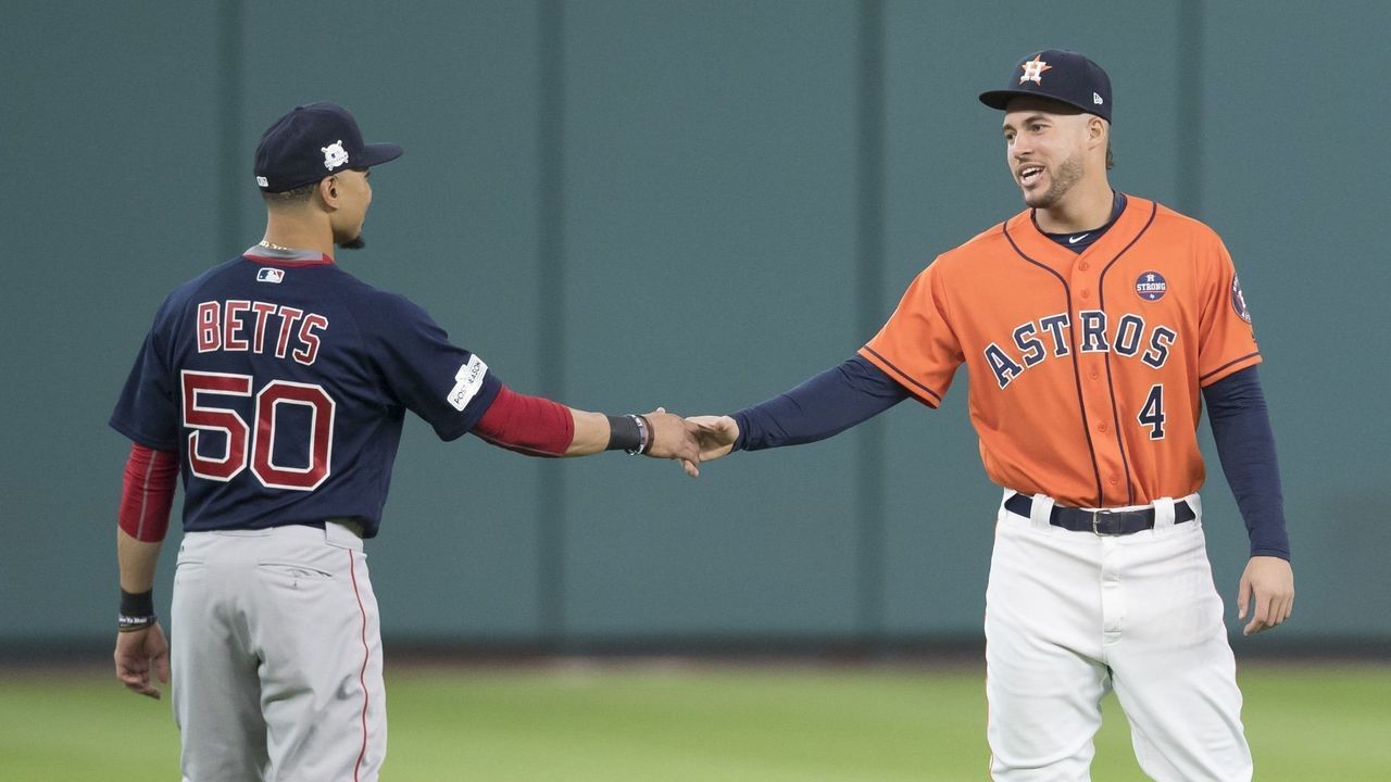 HOUSTON, TX - OCTOBER 6: Mookie Betts #50 of the Boston Red Sox talks with George Springer #4 of the Houston Astros before game two of the American League Division Series at Minute Maid Park on October 6, 2017 in Houston, Texas.