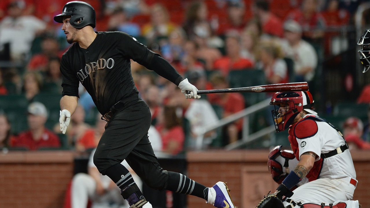 ST. LOUIS, MO - AUGUST 23: Nolan Arenado #28 of the Colorado Rockies hits a single in the ninth inning against the St. Louis Cardinals at Busch Stadium on August 23, 2019 in St. Louis, Missouri. Teams are wearing special color schemed uniforms with players choosing nicknames to display for Players' Weekend.