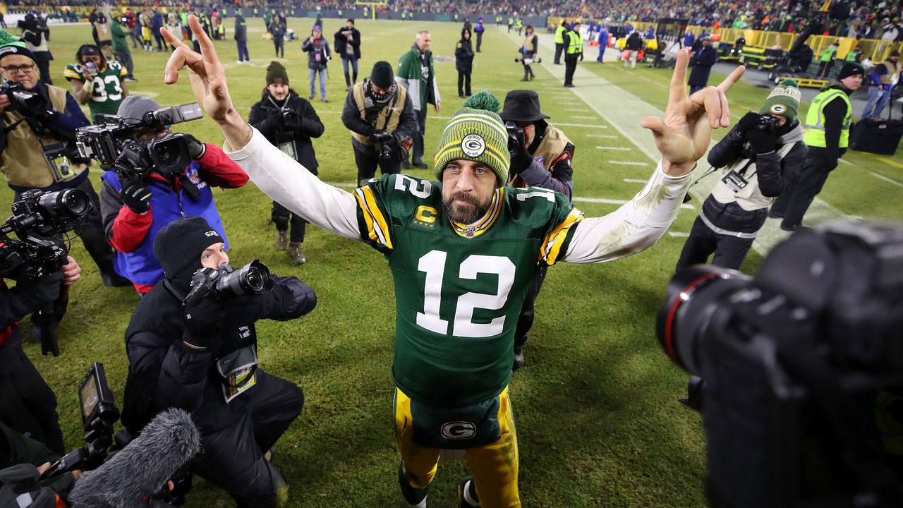 GREEN BAY, WISCONSIN - JANUARY 12: Aaron Rodgers #12 of the Green Bay Packers celebrates after defeating the Seattle Seahawks 28-23 in the NFC Divisional Playoff game at Lambeau Field on January 12, 2020 in Green Bay, Wisconsin.