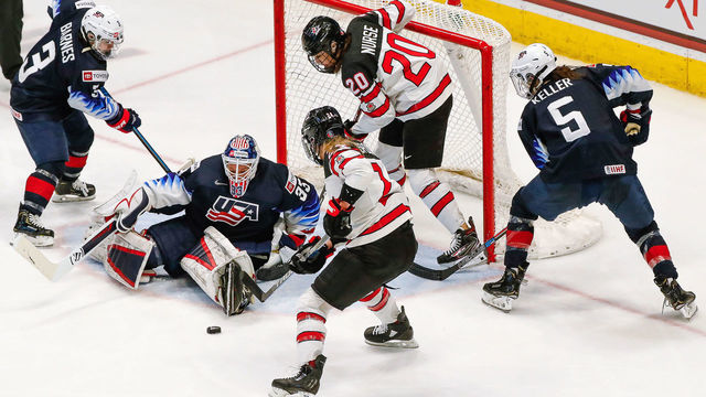 HARTFORD, CT - DECEMBER 14: Team USA goaltender Alex Cavallini (33) tracks loose puck in Team USA crease as Team USA defenseman Cayla Barnes (3), Team Canada forward Sarah Nurse (20), Team Canada forward Natalie Spooner (24), and Team USA defenseman Megan Keller (5) look for the rebound during the Canada Women's National Hockey and Team USA Women's Hockey Rivalry Series game on December 14, 2019, at XL Center in Hartford, CT.