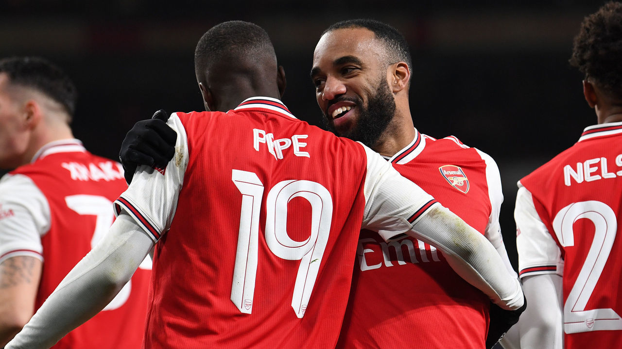 LONDON, ENGLAND - JANUARY 06: Alexandre Lacazette and Nicolas Pepe celebrate the Arsenal goal during the FA Cup Third Round match between Arsenal and Leeds United at Emirates Stadium on January 06, 2020 in London, England.