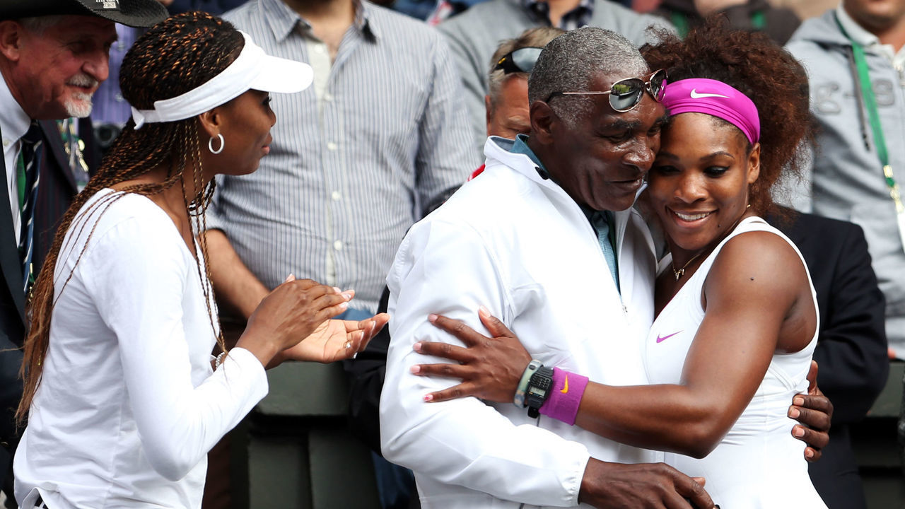 LONDON, ENGLAND - JULY 07: Serena Williams (R) of the USA celebrates with her father Richard Williams and sister Venus Williams after her Ladies’ Singles final match against Agnieszka Radwanska of Poland on day twelve of the Wimbledon Lawn Tennis Championships at the All England Lawn Tennis and Croquet Club on July 7, 2012 in London, England.