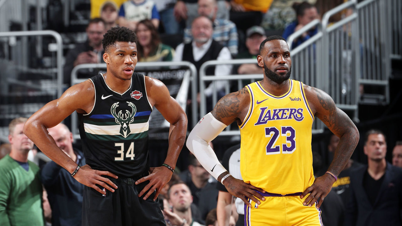MILWAUKEE, WI - DECEMBER 19: Giannis Antetokounmpo #34 of the Milwaukee Bucks and LeBron James #23 of the Los Angeles Lakers look on during a game on December 19, 2019 at the Fiserv Forum Center in Milwaukee, Wisconsin. Mandatory Copyright Notice: Copyright 2019 NBAE .