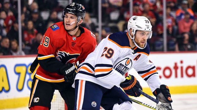 CALGARY, AB - SEPTEMBER 28: Calgary Flames Left Wing Matthew Tkachuk (19) and Edmonton Oilers Center Leon Draisaitl (29) skate during the second period of an NHL game where the Calgary Flames hosted the Edmonton Oilers on September 28, 2019, at the Scotiabank Saddledome in Calgary, AB.