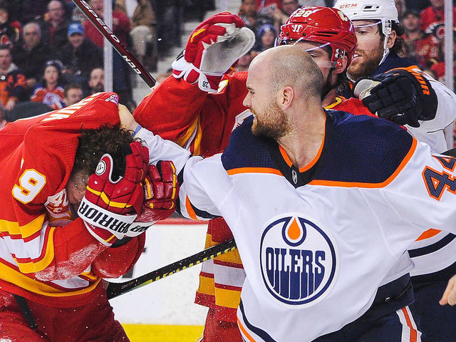 CALGARY, AB - JANUARY 11: Zack Kassian #44 of the Edmonton Oilers fights Matthew Tkachuk #19 of the Calgary Flames during an NHL game at Scotiabank Saddledome on January 11, 2020 in Calgary, Alberta, Canada.