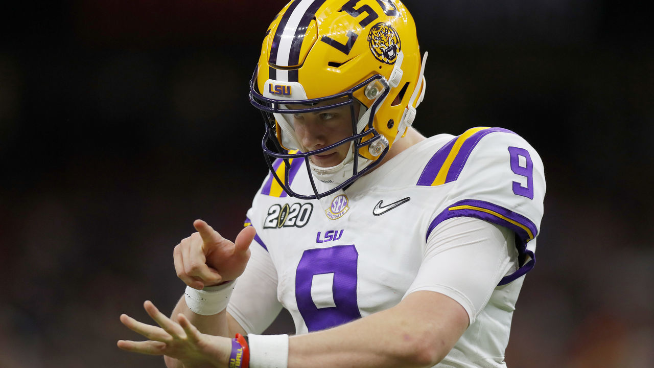 NEW ORLEANS, LOUISIANA - JANUARY 13: Joe Burrow #9 of the LSU Tigers reacts to a touchdown against Clemson Tigers during the third quarter in the College Football Playoff National Championship game at Mercedes Benz Superdome on January 13, 2020 in New Orleans, Louisiana.