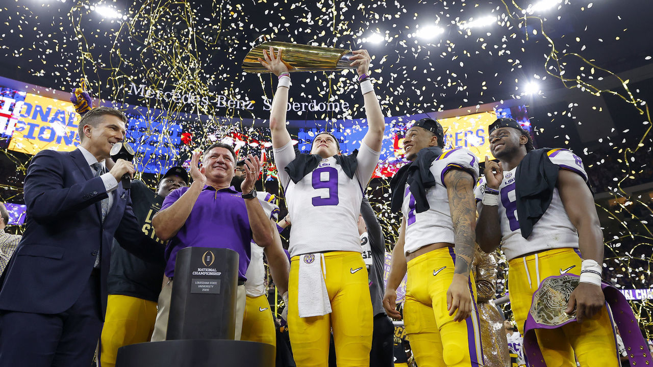 NEW ORLEANS, LOUISIANA - JANUARY 13: Head coach Ed Orgeron of the LSU Tigers, Joe Burrow #9 of the LSU Tigers and Grant Delpit #7 of the LSU Tigers celebrate with the trophy after defeating the Clemson Tigers 42-25 in the College Football Playoff National Championship game at Mercedes Benz Superdome on January 13, 2020 in New Orleans, Louisiana.