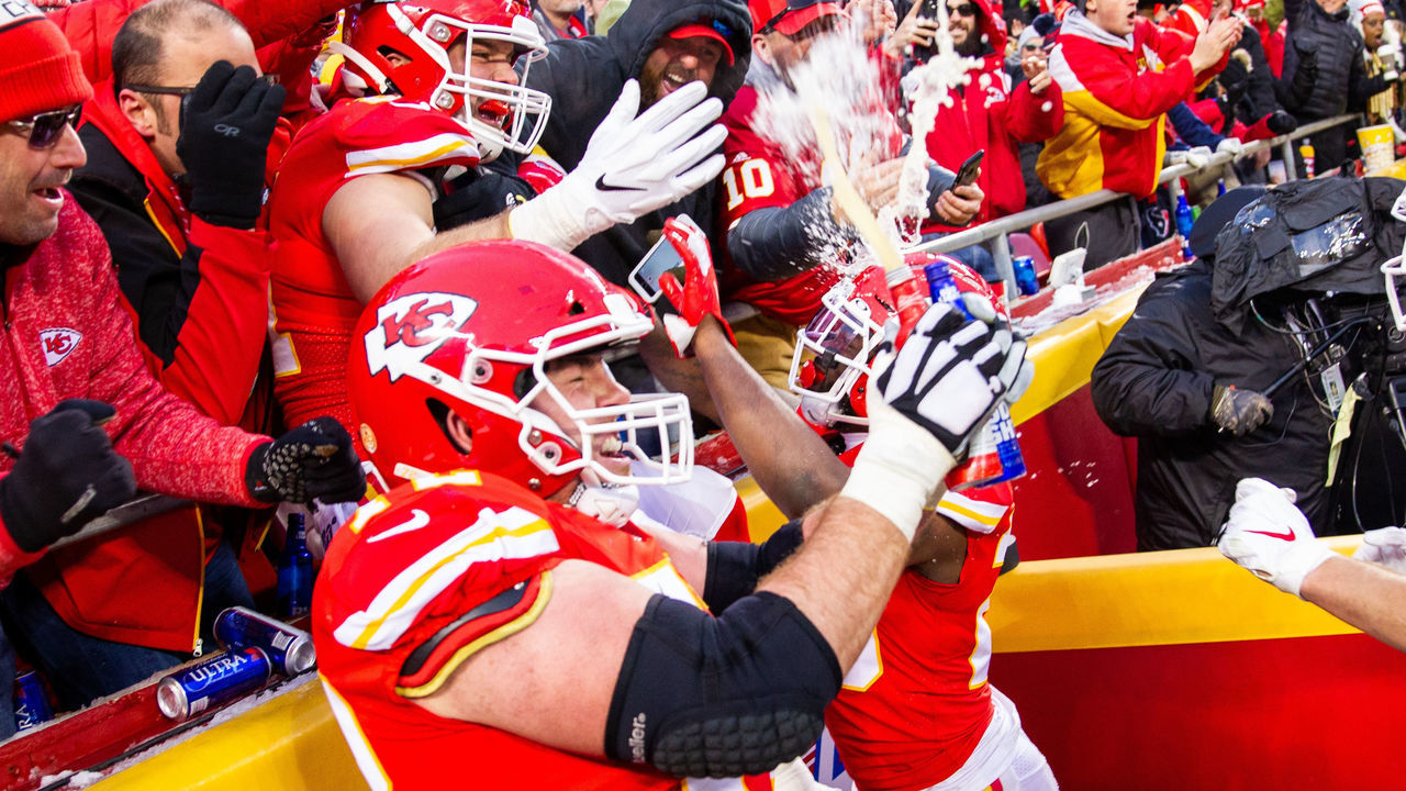 KANSAS CITY, MO - JANUARY 12: Kansas City Chiefs offensive tackle Eric Fisher (72) and Kansas City Chiefs running back Damien Williams (26) and Kansas City Chiefs tight end Blake Bell (81) celebrate with fans after a touchdown against the Houston Texans on January 12, 2019 at Arrowhead Stadium in Kansas City, Missouri.