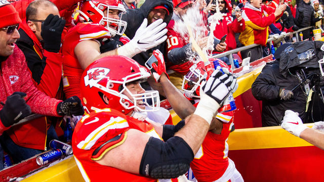 KANSAS CITY, MO - JANUARY 12: Kansas City Chiefs offensive tackle Eric Fisher (72) and Kansas City Chiefs running back Damien Williams (26) and Kansas City Chiefs tight end Blake Bell (81) celebrate with fans after a touchdown against the Houston Texans on January 12, 2019 at Arrowhead Stadium in Kansas City, Missouri.