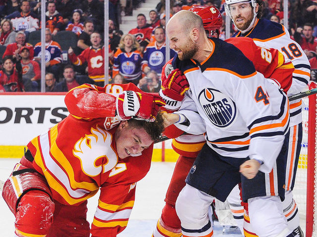 CALGARY, AB - JANUARY 11: Zack Kassian #44 of the Edmonton Oilers fights Matthew Tkachuk #19 of the Calgary Flames during an NHL game at Scotiabank Saddledome on January 11, 2020 in Calgary, Alberta, Canada.
