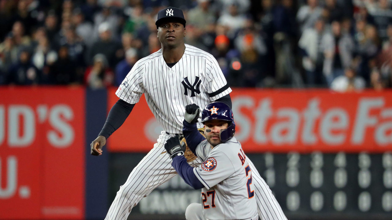 BRONX, NY - OCTOBER 18: Didi Gregorius #18 of the New York Yankees attempts to turn a double play as Jose Altuve #27 of the Houston Astros slides into second base during Game 5 of the ALCS at Yankee Stadium on Friday, October 18, 2019 in the Bronx borough of New York City.
