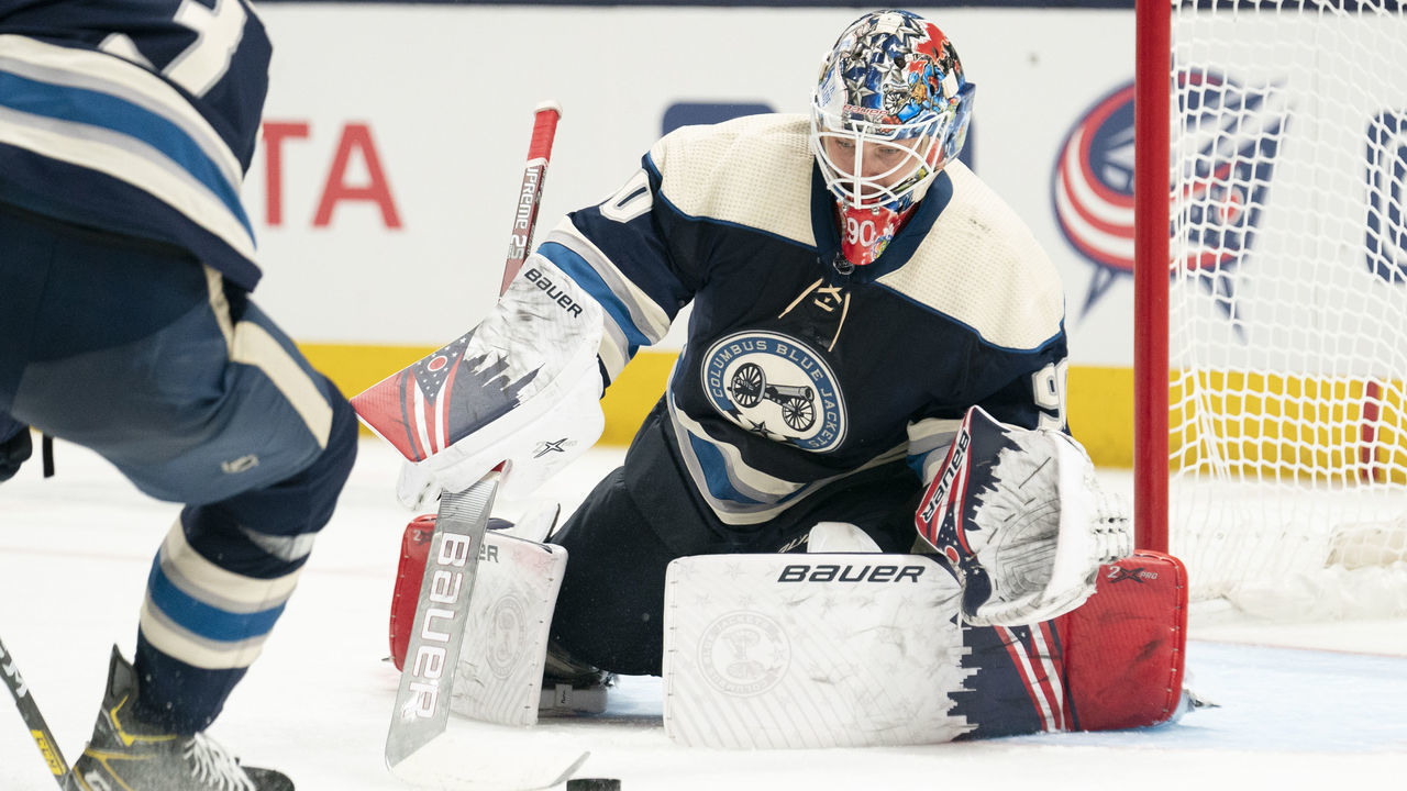 COLUMBUS, OH - JANUARY 14: Columbus Blue Jackets goaltender Elvis Merzlikins (90) reaches to stop the puck during the game between the Columbus Blue Jackets and the Boston Bruins at Nationwide Arena in Columbus, Ohio on January 14, 2020.