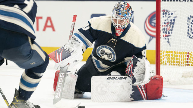 COLUMBUS, OH - JANUARY 14: Columbus Blue Jackets goaltender Elvis Merzlikins (90) reaches to stop the puck during the game between the Columbus Blue Jackets and the Boston Bruins at Nationwide Arena in Columbus, Ohio on January 14, 2020.