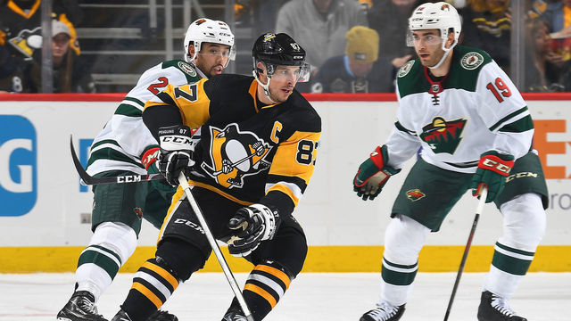PITTSBURGH, PA - JANUARY 14: Sidney Crosby #87 of the Pittsburgh Penguins handles the puck against the Minnesota Wild at PPG PAINTS Arena on January 14, 2020 in Pittsburgh, Pennsylvania.