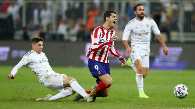 JEDDAH, SAUDI ARABIA - JANUARY 12: Federico Valverde of Real Madrid tackles Alvaro Morata of Atletico Madrid which results in the red card being shown to Federico Valverde of Real Madrid during the Supercopa de Espana Final match between Real Madrid and Club Atletico de Madrid at King Abdullah Sports City on January 12, 2020 in Jeddah, Saudi Arabia.