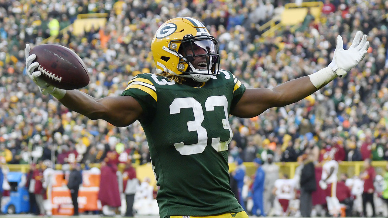 GREEN BAY, WISCONSIN - DECEMBER 08: Aaron Jones #33 of the Green Bay Packers reacts after getting a first down in the second half against the Washington Redskins at Lambeau Field on December 08, 2019 in Green Bay, Wisconsin.