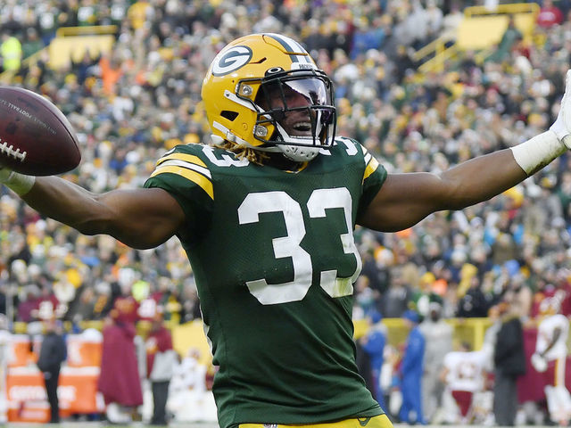 GREEN BAY, WISCONSIN - DECEMBER 08: Aaron Jones #33 of the Green Bay Packers reacts after getting a first down in the second half against the Washington Redskins at Lambeau Field on December 08, 2019 in Green Bay, Wisconsin.