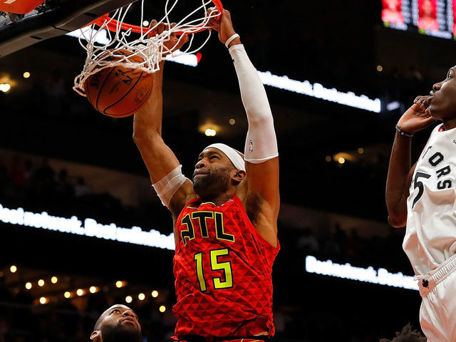 ATLANTA, GA - NOVEMBER 21: Vince Carter #15 of the Atlanta Hawks dunks and scores his 25,000th NBA point in the final seconds of their 124-108 loss to the Toronto Raptors at State Farm Arena on November 21, 2018 in Atlanta, Georgia.