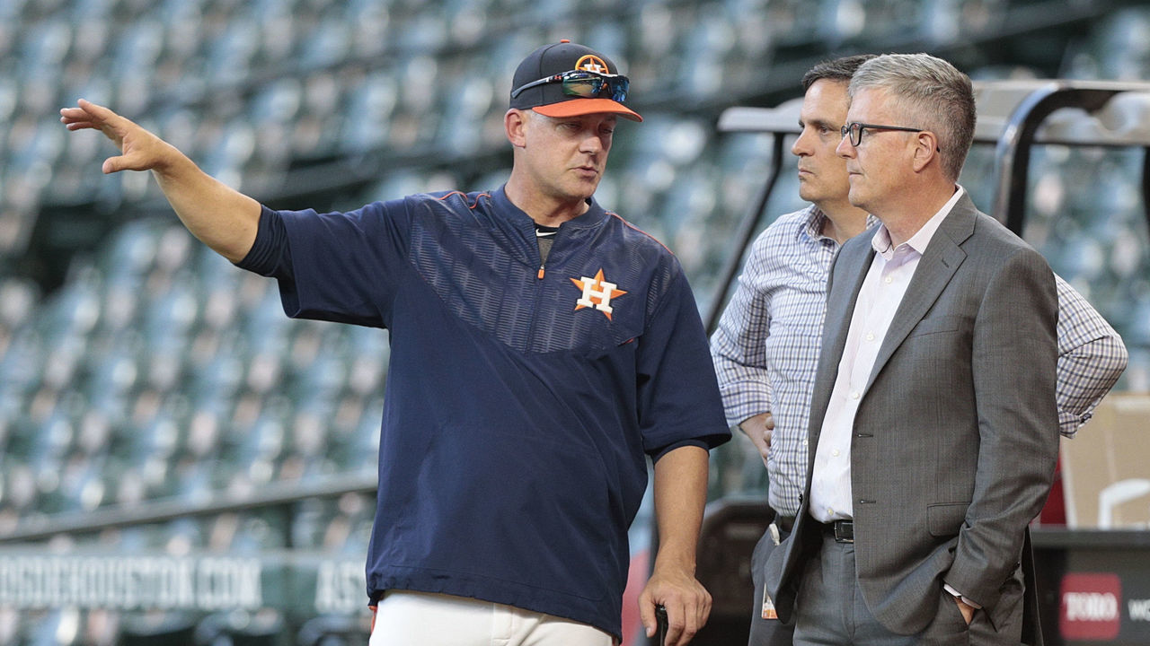 HOUSTON, TX - APRIL 04: Manager A.J. Hinch #14 of the Houston Astros and general manager Jeff Luhnow talk during batting practice at Minute Maid Park on April 4, 2017 in Houston, Texas.