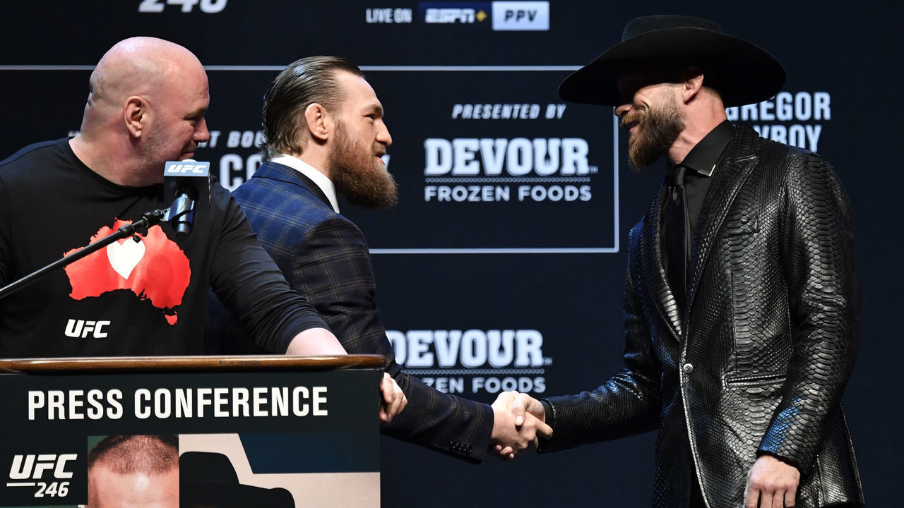 LAS VEGAS, NEVADA - JANUARY 15: Conor McGregor of Ireland and Donald Cerrone shake hands to start the UFC 246 press conference at Pearl Theater at the Palms Casino Resort on January 15, 2020 in Las Vegas, Nevada.
