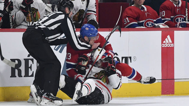 MONTREAL, QC - JANUARY 15: Max Domi #13 of the Montreal Canadiens gets into a scrum with Matthew Highmore #36 of the Chicago Blackhawks in the NHL game at the Bell Centre on January 15, 2020 in Montreal, Quebec, Canada.