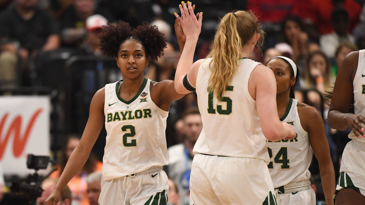 TAMPA, FL - APRIL 05: DiDi Richards #2 of the Baylor Bears high fives with teammate Lauren Cox #15 against the Oregon Ducks at Amalie Arena on April 5, 2019 in Tampa, Florida.