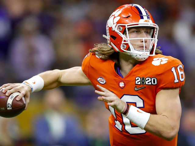NEW ORLEANS, LA - JANUARY 13: Clemson Tigers quarterback Trevor Lawrence (16) rolls out to pass during the second half of the College Football Playoff National Championship Game between the LSU Tigers and the Clemson Tigers on January 13, 2020 in New Orleans LA.