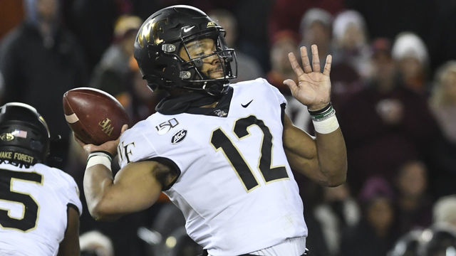 BLACKSBURG, VA - NOVEMBER 09: Quarterback Jamie Newman #12 of the Wake Forest Demon Deacons throws against the Virginia Tech Hokies in the second half at Lane Stadium on November 9, 2019 in Blacksburg, Virginia.