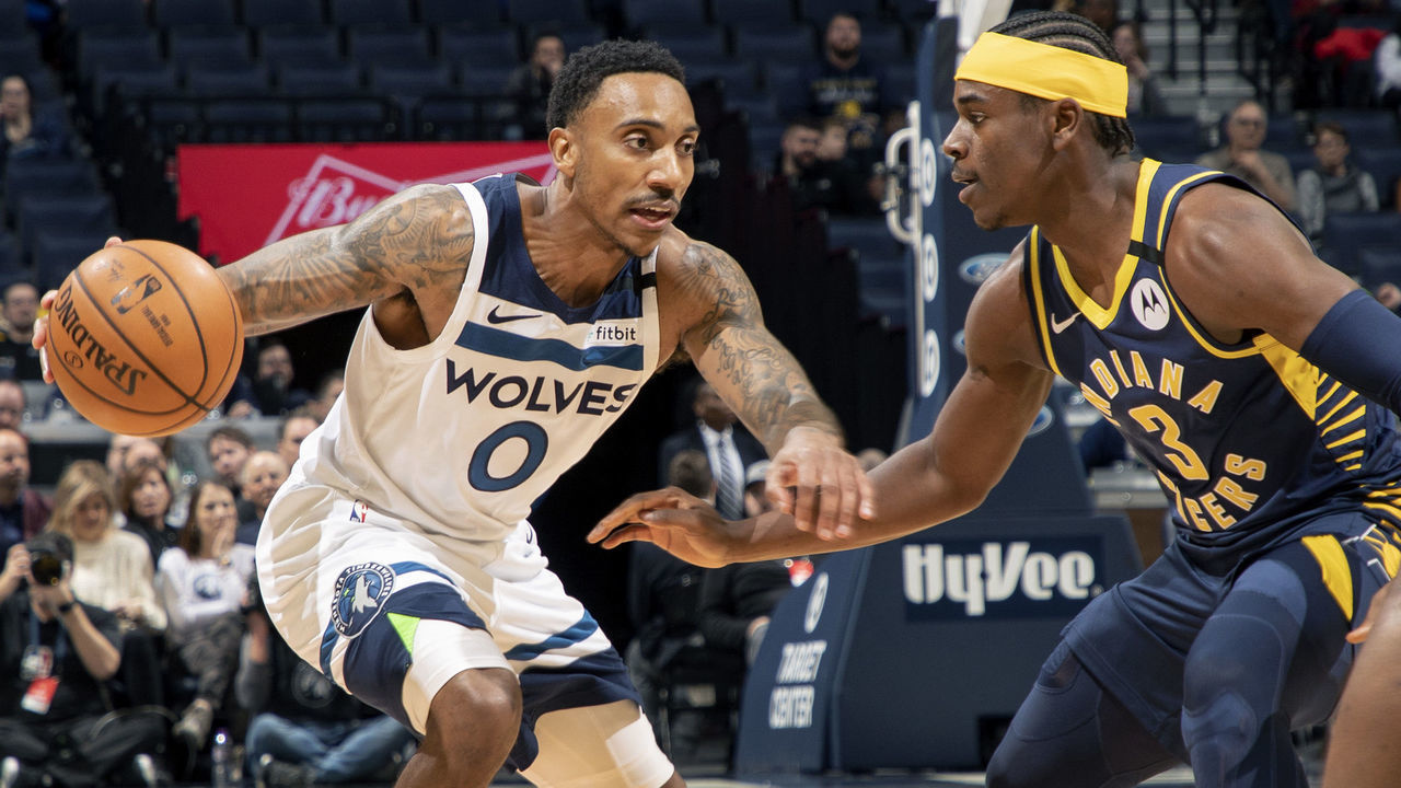 Minneapolis, MN January 15: Jeff Teague (0) of the Minnesota Timberwolves was defended by Aaron Holiday (3) of the Indiana Pacers in the first half.