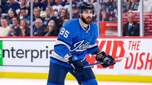 WINNIPEG, MB - JANUARY 14: Mathieu Perreault #85 of the Winnipeg Jets keeps an eye on the play during third period action against the Vancouver Canucks at the Bell MTS Place on January 14, 2020 in Winnipeg, Manitoba, Canada.