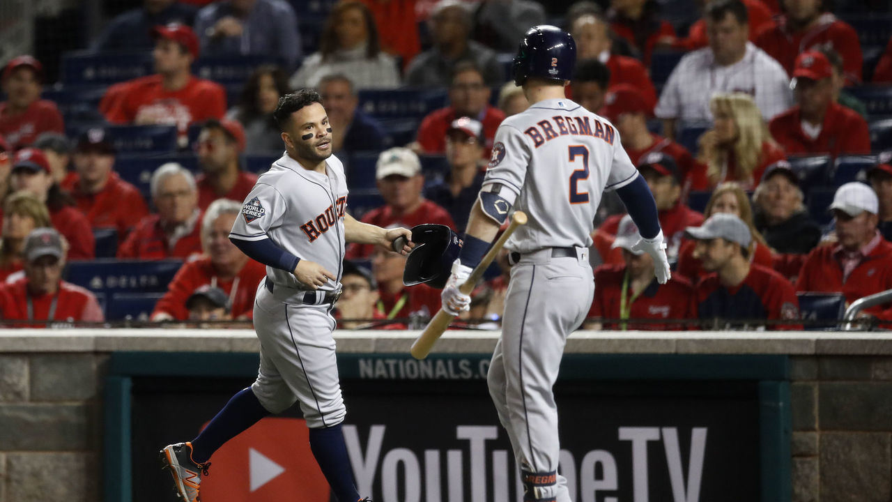 WASHINGTON, DC - OCTOBER 25: Jose Altuve #27 of the Houston Astros is congratulated by Alex Bregman #2 after scoring a run in the fifth inning during Game 3 of the 2019 World Series between the Houston Astros and the Washington Nationals at Nationals Park on Friday, October 25, 2019 in Washington, District of Columbia.