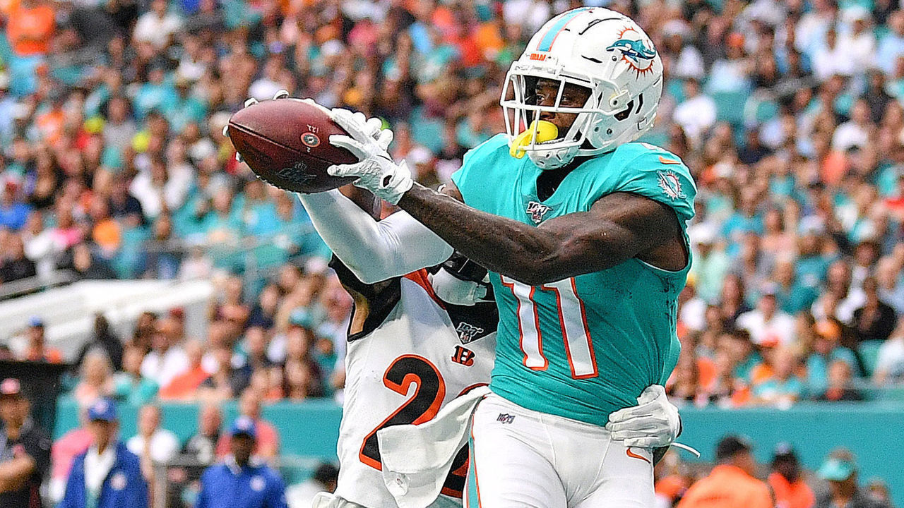 MIAMI, FLORIDA - DECEMBER 22: DeVante Parker #11 of the Miami Dolphins catches a touchndown against the Cincinnati Bengals in the first quarter at Hard Rock Stadium on December 22, 2019 in Miami, Florida.