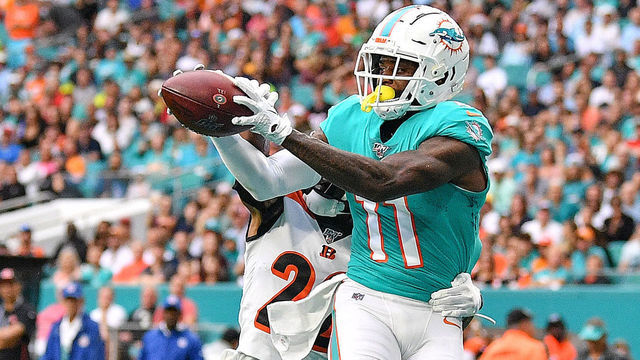 MIAMI, FLORIDA - DECEMBER 22: DeVante Parker #11 of the Miami Dolphins catches a touchndown against the Cincinnati Bengals in the first quarter at Hard Rock Stadium on December 22, 2019 in Miami, Florida.