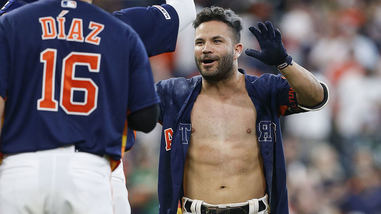 HOUSTON, TEXAS - APRIL 07: Jose Altuve #27 of the Houston Astros celebrates after his walk forced in the winning run in the ninth inning against the Oakland Athletics at Minute Maid Park on April 07, 2019 in Houston, Texas.
