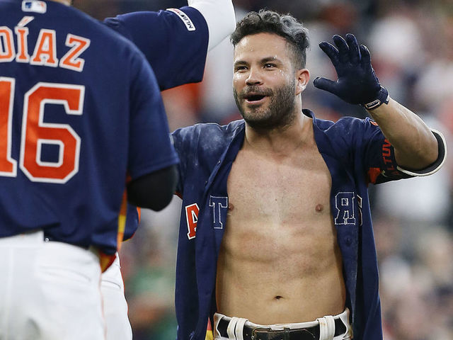 HOUSTON, TEXAS - APRIL 07: Jose Altuve #27 of the Houston Astros celebrates after his walk forced in the winning run in the ninth inning against the Oakland Athletics at Minute Maid Park on April 07, 2019 in Houston, Texas.