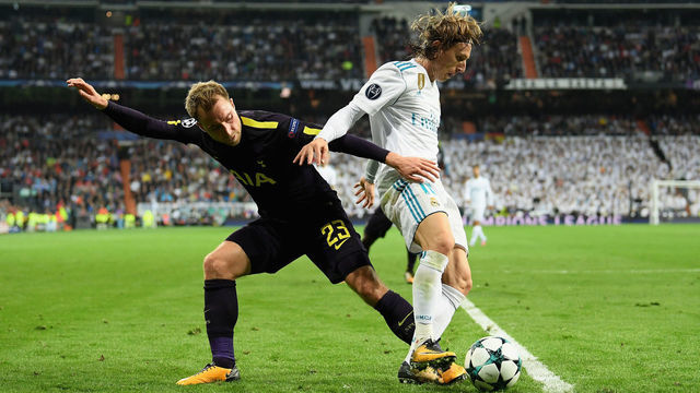 MADRID, SPAIN - OCTOBER 17: Christian Eriksen of Tottenham Hotspur and Luka Modric of Real Madrid battle for possession during the UEFA Champions League group H match between Real Madrid and Tottenham Hotspur at Estadio Santiago Bernabeu on October 17, 2017 in Madrid, Spain.