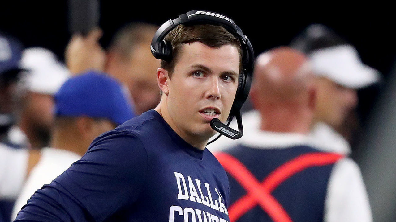 ARLINGTON, TEXAS - AUGUST 29: Offensive coordinator Kellen Moore of the Dallas Cowboys on the sideline against the Tampa Bay Buccaneers in the fourth quarter of a NFL preseason game at AT&T Stadium on August 29, 2019 in Arlington, Texas.