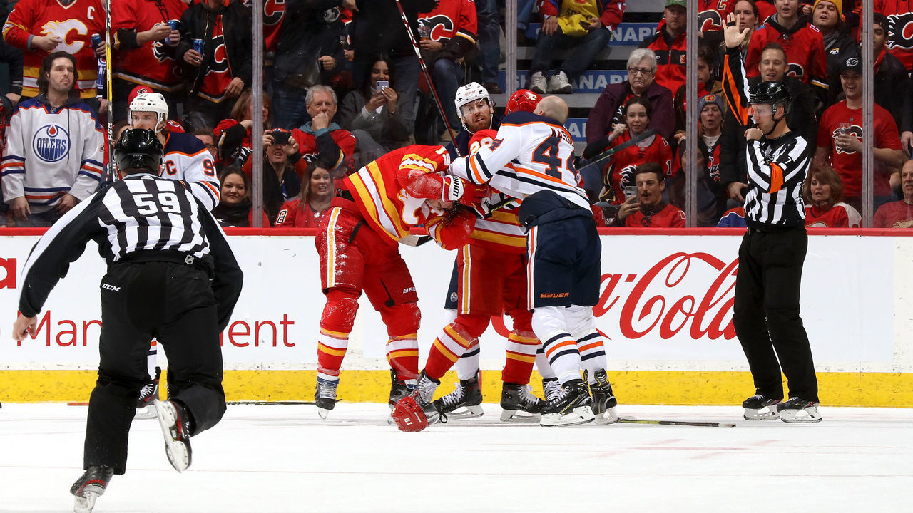 CALGARY, ALBERTA - JANUARY 11: Matthew Tkachuk #19 of the Calgary Flames fights Zack Kassian #44 of the Edmonton Oilers at Scotiabank Saddledome on January 11, 2020 in Calgary, Canada.