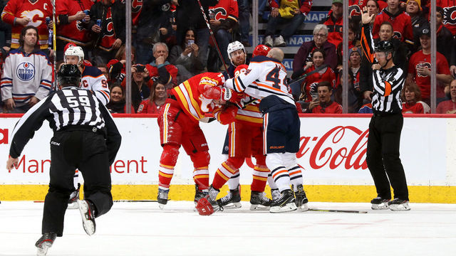 CALGARY, ALBERTA - JANUARY 11: Matthew Tkachuk #19 of the Calgary Flames fights Zack Kassian #44 of the Edmonton Oilers at Scotiabank Saddledome on January 11, 2020 in Calgary, Canada.