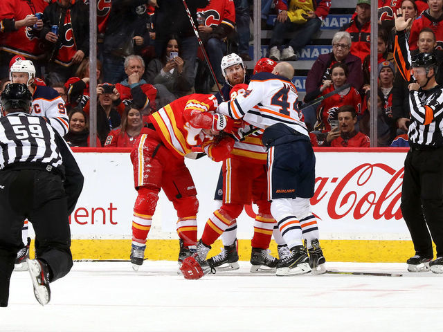 CALGARY, ALBERTA - JANUARY 11: Matthew Tkachuk #19 of the Calgary Flames fights Zack Kassian #44 of the Edmonton Oilers at Scotiabank Saddledome on January 11, 2020 in Calgary, Canada.