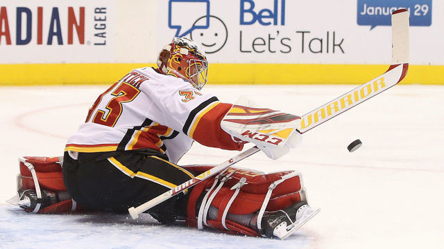 TORONTO, ON- JANUARY 16 - Calgary Flames goaltender David Rittich (33) makes a save as the Toronto Maple Leafs play the Calgary Flames in Toronto. January 16, 2020. (Steve Russell/Toronto Star via Getty Images)