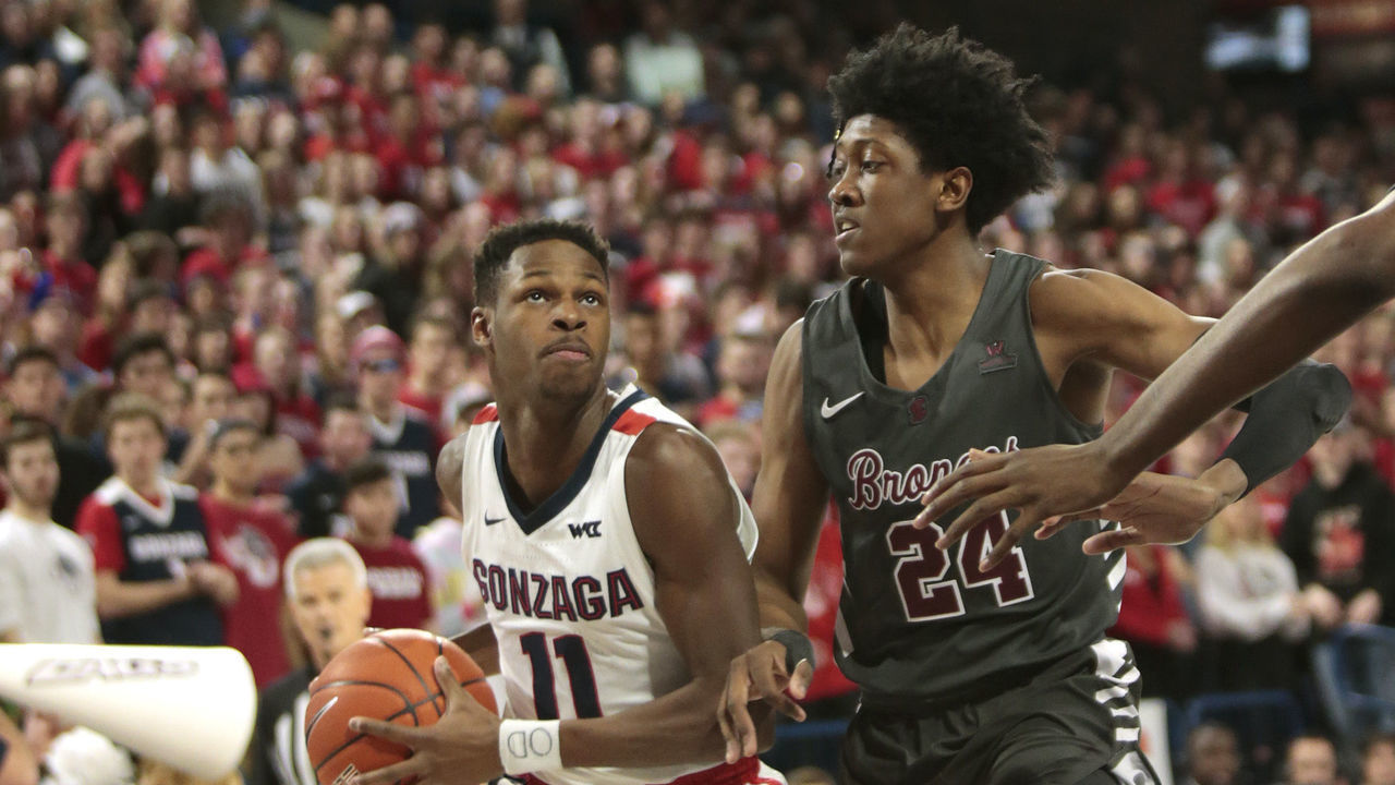 SPOKANE, WASHINGTON - JANUARY 16: Joel Ayayi #11 of the Gonzaga Bulldogs drives against Jalen Williams #24 of the Santa Clara Broncos in the first half at McCarthey Athletic Center on January 16, 2020 in Spokane, Washington.