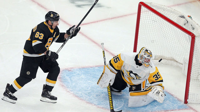 BOSTON, MA. - JANUARY 16: Brad Marchand #63 watches Patrice Bergeron #37 of the Boston Bruins goal go past Tristan Jarry #35 of the Pittsburgh Penguins during the third period of the NHL game at the TD Garden on January 16, 2020 in Boston, Massachusetts. (Staff Photo By Matt Stone/MediaNews Group/Boston Herald)