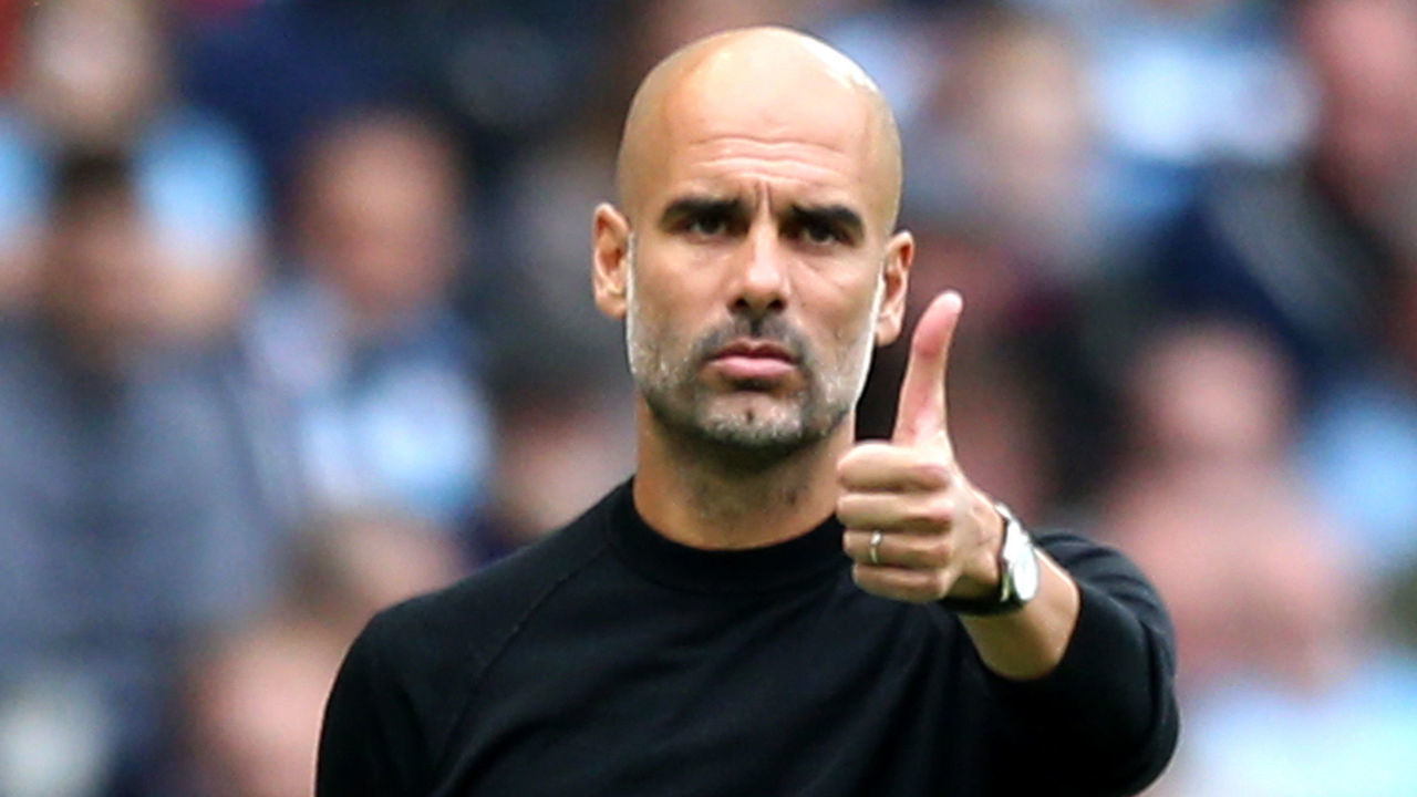 MANCHESTER, ENGLAND - SEPTEMBER 15: Josep Guardiola, Manager of Manchester City gives a thumbs up during the Premier League match between Manchester City and Fulham FC at Etihad Stadium on September 15, 2018 in Manchester, United Kingdom.