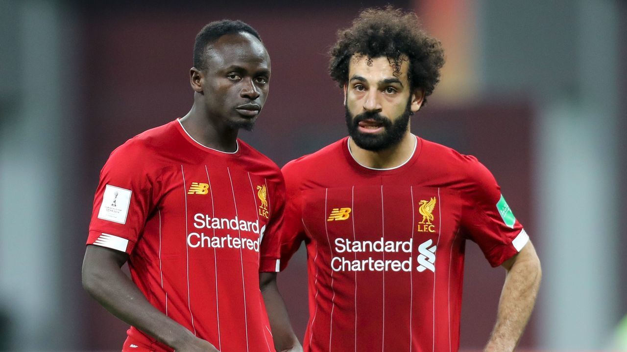 Liverpool's Senegalese striker Sadio Mane (L) speaks with Liverpool's Egyptian midfielder Mohamed Salah during the 2019 FIFA Club World Cup semi-final football match between Mexico's Monterrey and England's Liverpool at the Khalifa International Stadium in the Qatari capital Doha on December 18, 2019.